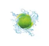 A green round object, likely a fruit, is shown partially submerged in splashing water with yellow accents. The water creates a swirling vortex around the object. Produktbild-Vorschau