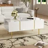 A modern living room scene with a white couch and a white coffee table with gold accents. Produktbild-Vorschau