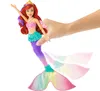 Ariel mermaid doll with a hand holding it. Anteprima dell’immagine prodotto