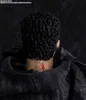 Close-up of the back of a figure's head and neck, showing a tattoo. Podgląd zdjęcia produktu