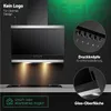 A black and silver range hood is mounted above a stovetop, with lighting illuminating the cooking surface. The background is dark with green accents and text. Produktbild-Vorschau