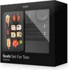 A black box packaging for a sushi set for two, with a window showing some of the contents. Voir les images du produit