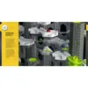 A complex marble run structure with multiple levels and pathways, featuring colorful marbles in motion. Anteprima dell’immagine prodotto