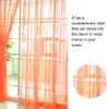 Orange sheer curtains hanging in front of a window, with a text box describing the product's style. Produktbild-Vorschau