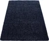 A dark blue shaggy rug is shown from a slightly elevated angle against a white background. Anteprima dell’immagine prodotto