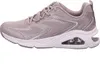 A side view of a taupe Skechers sneaker with silver glitter accents. Voir les images du produit