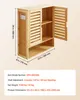 A bamboo bathroom cabinet with dimensions and specifications displayed. Voir les images du produit