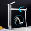 A chrome faucet with water flowing from it, shown against a black background. An inset circle shows a close-up of the water stream. Podgląd zdjęcia produktu