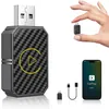 A hand holding a small adapter next to a larger adapter, a phone, and cables, all related to car connectivity. Produktbild-Vorschau
