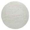 A round, fluffy, white rug is shown from a top-down perspective against a white background. Produktbild-Vorschau
