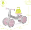A light gray and pink balance bike with various measurements and weight limits indicated by text overlays. Náhľad obrázku produktu