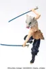 A figurine of Inosuke Hashibira from Demon Slayer, posed in action with two swords. Náhled obrázku produktu