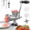 A manual meat grinder with various attachments and some sausages in the foreground. Produktbild-Vorschau