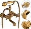 A vintage-style brass bathtub faucet with a handheld showerhead. Náhled obrázku produktu