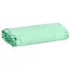 A roll of green trash bags on a white background. Podgląd zdjęcia produktu