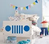 A child's bedroom with a bed decorated with a jeep grill design. Náhled obrázku produktu
