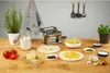 A pasta maker and ingredients are arranged on a wooden table, ready for making fresh pasta. Anteprima dell’immagine prodotto