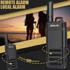 Two people with backpacks stand on a beach at sunset, with two walkie-talkies in the foreground. One walkie-talkie is larger and in the right foreground, while a smaller one is in the left foreground. Text overlays highlight features. Produktbild-Vorschau
