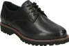 A studio shot of a single black leather shoe. Anteprima dell’immagine prodotto