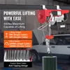 A red electric hoist is shown suspended from a beam, with a car in the background. Text overlays describe its features and specifications. Voir les images du produit
