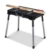 A black folding workbench with silver legs is shown with a piece of wood clamped to the top. Náhľad obrázku produktu