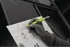 A person's hand holding a neon green marker and writing on a blueprint. Produktbild-Vorschau
