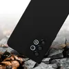 A black phone case is shown on a cracked surface with fallen leaves. Produktbild-Vorschau