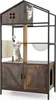 A multi-level cat tree with a cabinet base, scratching post, and hanging toys, featuring two cats interacting with the structure. Podgląd zdjęcia produktu