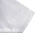 A close-up view of a transparent grid film, showing its woven texture and a reinforced edge. Produktbild-Vorschau