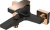A product shot of a black and gold bathtub faucet against a white background. Produktbild-Vorschau