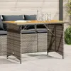 An outdoor table and seating set on a patio. Náhled obrázku produktu