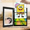 A person is holding up a drawing of Spongebob Squarepants, which is placed in a black frame that can store multiple drawings. Produktbild-Vorschau