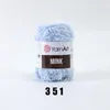 A ball of light blue fluffy yarn on a plain background. Produktbild-Vorschau