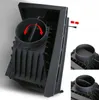 A close-up view of a black cast iron fireplace insert with a circular damper mechanism. Produktbild-Vorschau