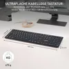 A black wireless keyboard is shown on a desk with some text overlays indicating its features and dimensions. Produktbild-Vorschau