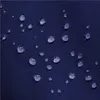Close-up of water droplets on a dark blue fabric surface. Produktbild-Vorschau