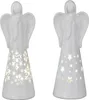 Two white ceramic angel figurines with cut-out designs illuminated from within. Produktbild-Vorschau