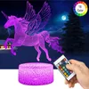 A 3D LED unicorn lamp with a remote control, set against a night sky background with a moon and trees. Produktbild-Vorschau
