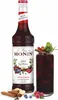 A bottle of Monin Spiced Red Berries syrup and a glass of a red berry drink. Voir les images du produit