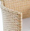 Close-up of the woven texture of a chair armrest. Produktbild-Vorschau