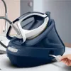 A hand is shown plugging in a blue Tefal steam iron station. Produktbild-Vorschau