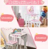 A collage showing a children's vanity table and a desk, both with stools and unicorn motifs. The top image shows the vanity set in a room with balloons and gift bags, while the bottom image shows the desk set up with a laptop and rainbow decorations. Produktbild-Vorschau