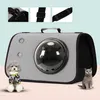 A pet carrier with a clear bubble window, shown with a small dog and a cat. Produktbild-Vorschau