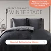 A bed with dark gray bedding, set against a light gray background, with text overlays. Anteprima dell’immagine prodotto