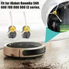 A robotic vacuum cleaner and its replacement side brushes are shown on a floor with dirt. Produktbild-Vorschau
