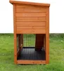 A wooden rabbit hutch with a black tray and wire mesh is placed on a grassy lawn. Produktbild-Vorschau