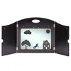 A black wooden theater stage with cutouts for a scene, featuring silhouettes of a tree, a horse, a house, a cloud, and the sun. Náhľad obrázku produktu