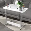 A white laptop table with wheels is placed next to a gray sofa, with a laptop, a plant, and a mug on it. Anteprima dell’immagine prodotto