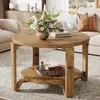 A living room scene featuring a wooden coffee table with decorative items. Produktbild-Vorschau