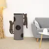 Two cats climbing on a cat tree next to a sofa and a lamp. Náhľad obrázku produktu